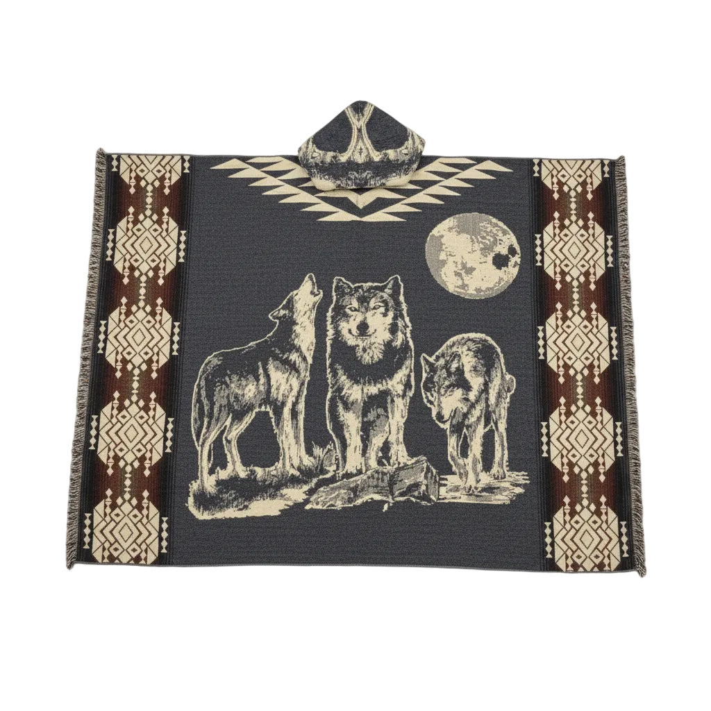 Premium rustic wolf hooded poncho featuring three wolves beneath a full moon with southwestern geometric patterns, woven artisan texture, fringe tassels, and traditional Mexican-inspired design in black, cream, and brown tones.